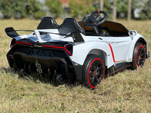 white lambo showing carbon fiber and exhaust